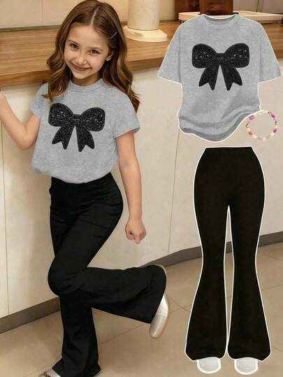 2pcs/Set Young Girl Casual Minimalist Black Printed Pearl Bow Graphic Grey Short Sleeve Round Neck T-Shirt And Black Flare Pants, Cute Cartoon Stylish Outfit For Girls, Suitable For Spring And Summer