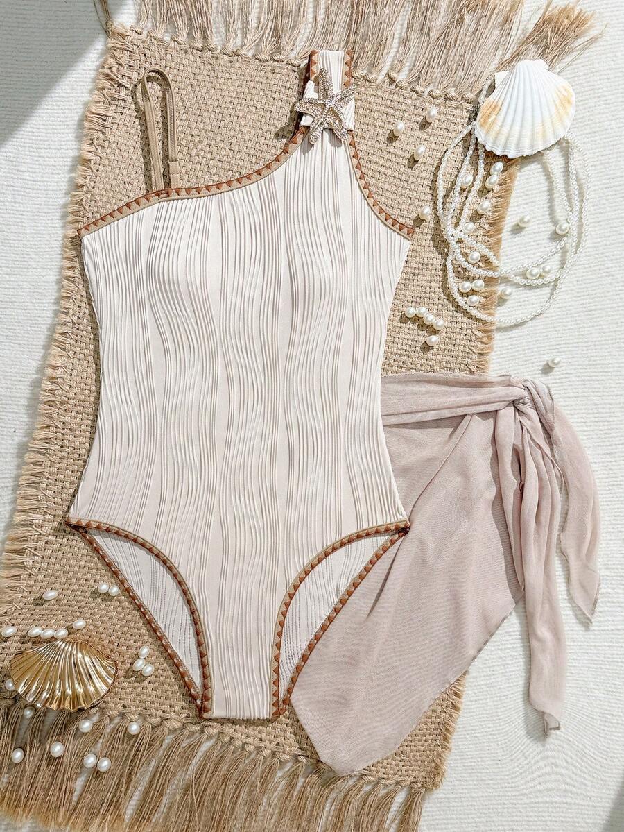 SHEIN Bộ áo tắm liền thân và váy sarong màu hồng đào nhạt dành cho thiếu nữ, họa tiết vỏ sò lượn sóng, mang đến phong cách biển cả dịu dàng. - Màu be - Xem 1