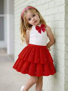 Elladie kids 两件套女童派对珍珠蝴蝶结套装，白色露背罗纹上衣饰有珍珠蝴蝶结，搭配红色层叠蛋糕裙，裙摆也饰有珍珠，散发着优雅甜美的派对气息，适合日常外出、生日派对、家庭聚会等场合，是幼儿女童完美的夏季服装。 - 紅色 - 查看 5