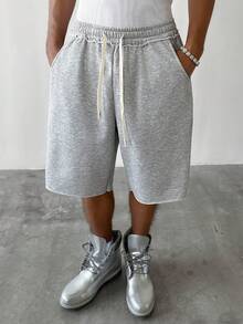 PAVTROS Quần short thể thao nam dáng rộng, thoải mái, phù hợp cho mặc hàng ngày, đi chơi cuối tuần, gặp gỡ bạn bè, du lịch và các hoạt động xã hội thư giãn khác. Chiếc quần short đa năng này là một món đồ thiết yếu trong tủ quần áo của nam giới, là món quà tuyệt vời dành cho bạn trai hoặc chồng. Thích hợp cho mùa xuân đến hè, mùa hè, kỳ nghỉ, phong cách cổ điển, đi chơi, tiệc tùng, lễ hội, quà tặng cho bạn trai. Quần short nam màu xám dáng rộng dài đến đầu gối với gấu quần tua rua, quần short mùa hè đa năng, quần short rộng thùng thình. - Xám - Xem 3