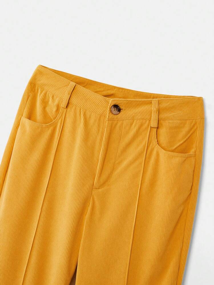 Pantalones de pana amarillo mostaza con botones delanteros, estilo vintage con detalle de costura frontal, estilo francés estilo parisino