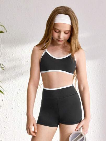 SHEIN Bộ áo hai dây và quần short phối màu dành cho bé gái tuổi teen, thích hợp cho yoga, tập luyện nhẹ hoặc mặc hàng ngày.