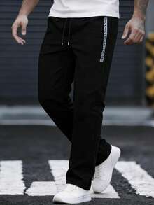 EGENSIO Quần nam in chữ, cạp chun có túi, kiểu dáng thường ngày. - màu đen - Xem 1