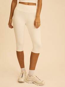Aralina Bộ đồ thể thao nữ gồm áo hai dây ngắn màu trơn và quần legging lửng 7/8. - trắng - Xem 4