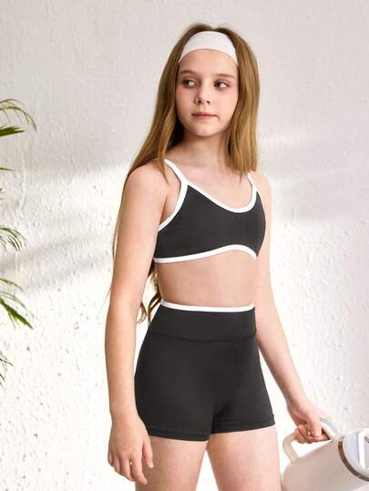 SHEIN Bộ áo hai dây và quần short phối màu dành cho bé gái tuổi teen, thích hợp cho yoga, tập luyện nhẹ hoặc mặc hàng ngày.