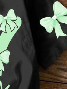 少女休闲简约个性酷炫数字67，蝴蝶结装饰，黑色短袖圆领印花T恤，适合夏季穿着。67号T恤，女童T恤，6T服装，街头服饰，女童休闲圆领T恤。 - 彩色 - 查看 5