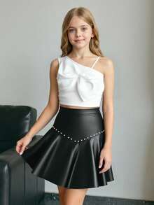Elladie kids Conjunto de 2 piezas dulce y fresco para niñas preadolescentes, top de un hombro con lazo a juego con minifalda de cuero PU con tachuelas, ajustado y favorecedor, que irradia un ambiente dulce y caliente de chica, adecuado para salidas casuales, fiestas o uso escolar, fácil de crear looks personalizados - Blanco y Negro - Ver 10