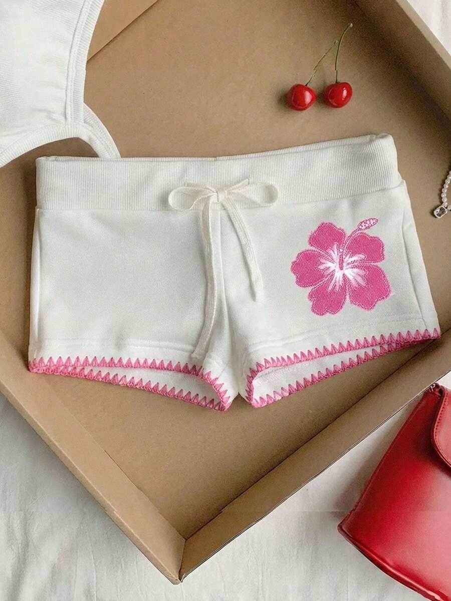 SHEIN EZwear Quần short ôm sát màu hồng nhạt, kiểu dáng tối giản, chống xù lông, viền ren thêu, cạp chun có dây rút, họa tiết hoa, thích hợp cho mùa hè, kỳ nghỉ, tiệc bãi biển. - trắng - Xem 1