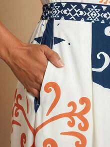 Travachic Bộ áo liền quần ống rộng, in họa tiết, chất liệu vải dệt dành cho nữ. - Nhiều màu - Xem 4