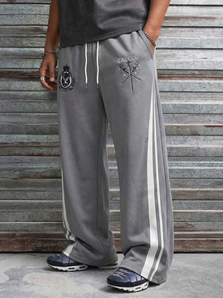 AXEPEAK Men's Loose Fit Wide Leg Sweatpants Grey Fleece Eagle Patch Sword Graphic Drawstring Waist Streetwear Fall Winter Pants Grey Sweatpants Men's Grey Joggers Streetwear Sweatpants Men's Track Pants - Grey - View 1