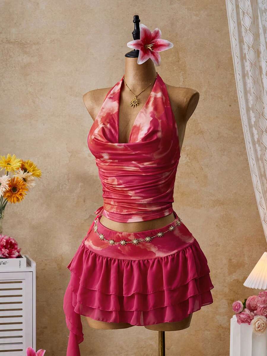 Femesol 两件套度假粉色印花露背吊带不对称上衣搭配迷你印花裙，尽显优雅气质，适合锐舞派对、音乐节、街头风、演唱会、夜店、约会、生日派对、派对必备、基础款、外出、休闲针织、亮面等场合，也是毕业季的理想之选。