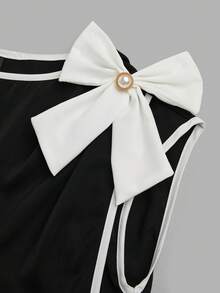 EMERY ROSE 女士优雅春夏撞色衬衫 - 饰有蝴蝶结和水钻纽扣，采用收腰褶裥设计、宽领口和短袖。这款优雅又不失俏皮的黑白上衣，无论是商务通勤还是日常穿着都非常合适。黑白撞色上衣，舞会礼服，春夏上衣，沙滩装，优雅派对上衣，休闲上衣，婚礼宾客装，女士奢华晚礼服，女士度假装，女士毕业典礼上衣，蝴蝶结上衣，黑白女士上衣和衬衫，女士工作上衣，工作衬衫，蝴蝶结衬衫，女士礼服上衣，女士上衣，优雅高贵的正式女士上衣，优雅套装，女士正式服装，女士上衣，女士优雅连衣裙 - 黑與白 - 查看 7