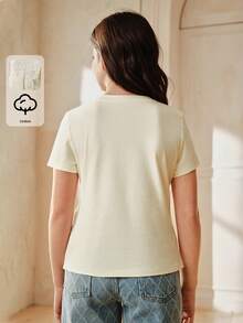 Anewsta Camiseta de manga corta con cuello redondo y decoración de lazo, en color amarillo suave, 100% algodón, para niña - Amarillo - Ver 3