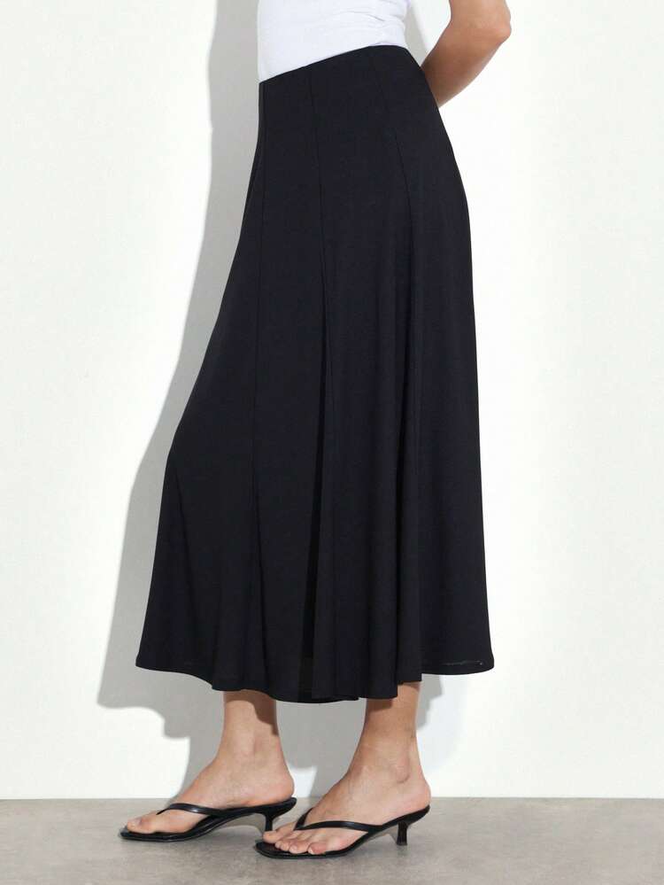 KSTM Women's Black Midi A-Line Skirt With Flowing Silhouette And High Waist Design Perfect For Casual And Semi-Formal Occasions