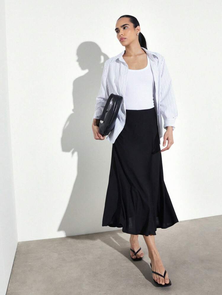 KSTM Women's Black Midi A-Line Skirt With Flowing Silhouette And High Waist Design Perfect For Casual And Semi-Formal Occasions