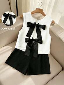 SHEIN Franclia Bộ đồ 2 mảnh mùa xuân mới, kiểu dáng giản dị, đa năng, thoải mái, gồm áo vest dệt kim trắng không tay cổ tròn, lưng hở, thắt nơ đen và quần short dệt kim rộng màu đen dành cho nữ. - Nhiều màu - Xem 2