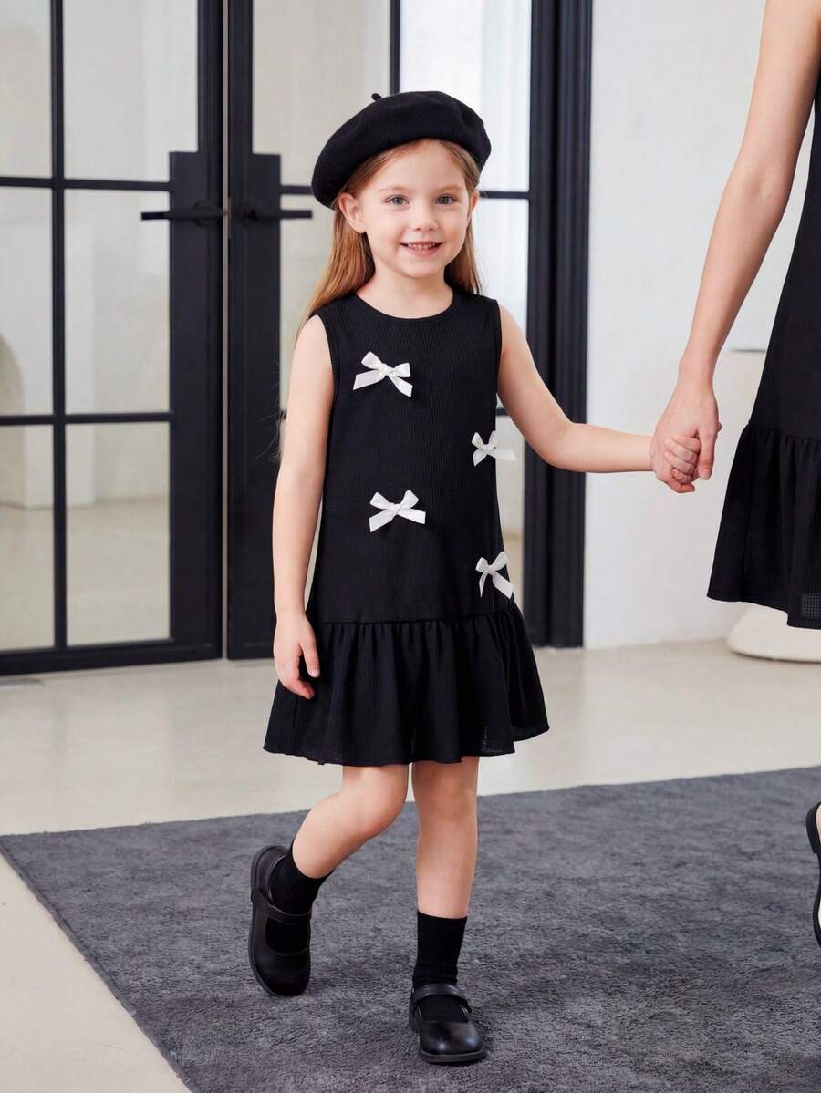 Đầm không tay mùa hè mới cho bé gái, có bèo nhún ở gấu và điểm nhấn nơ, màu trắng. - màu đen - Xem 1