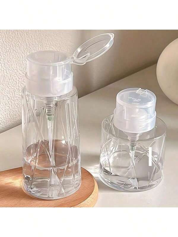 1个透明可重复灌装的卸甲油瓶，带泵头和锁扣，适用于美甲