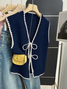 Franclia 新款轻柔针织背心，腰部系带，V领波浪形黑色滚边撞色开衫。简约的底色凸显精致细节，柔软针织面料，透气舒适，适合初秋时节搭配衬衫、T恤或薄外套穿着。百搭，略微宽松的版型，可调节抽绳腰带，适合不同体型。 - 藏蓝色 - 查看 4