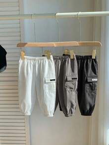 SHEIN Quần dài thể thao thường ngày cho bé trai, có túi nắp và họa tiết chữ. - Nhiều màu - Xem 5