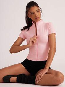 Hauture Chaqueta corta de yoga con cuello alto ajustada y cremallera para mujer, versátil para hacer ejercicio y uso casual - Rosa Pálido - Ver 1
