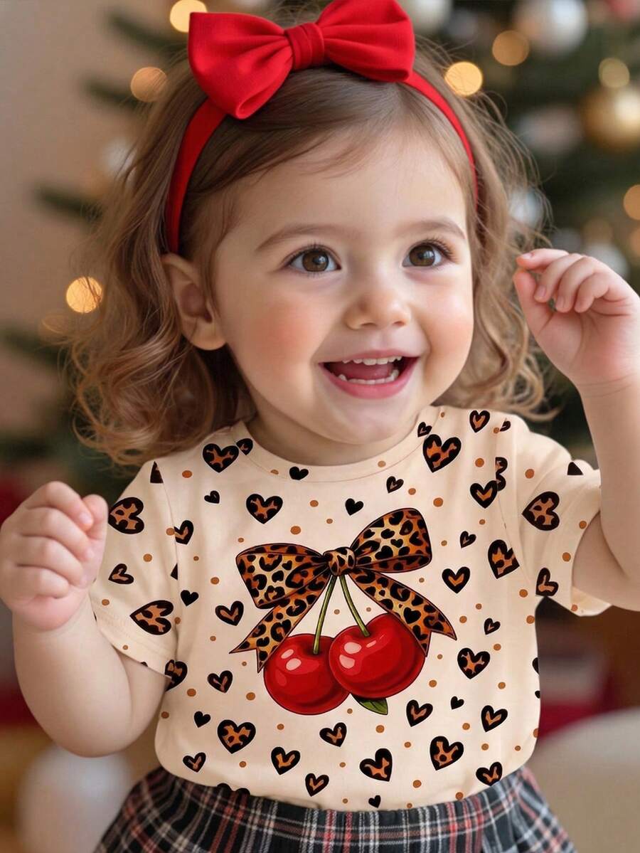 1件 6个月-2-3岁女宝宝活力甜美风/复古甜心领口短袖T恤,杏色底+豹纹蝴蝶结樱桃+爱心波点印花不对称下摆,轻薄面料,可爱女宝宝上衣,适合日常穿着、上学、休闲、生日派对、春夏秋季穿着。 - 彩色 - 查看 1