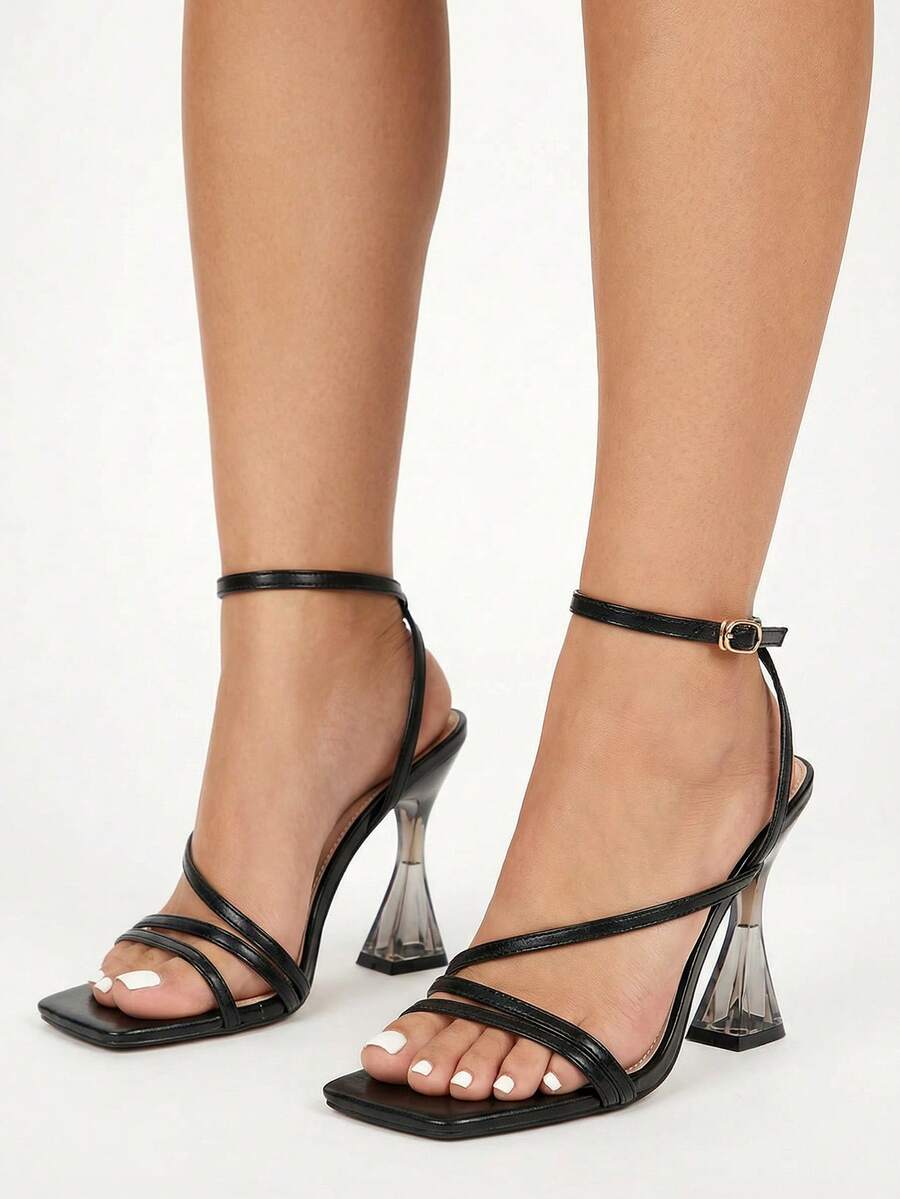 Glitzique Sandalias de tacón alto de moda elegantes y sexys para damas con puntera cuadrada, tira rayada y tacón de cristal - Negro - Ver 1