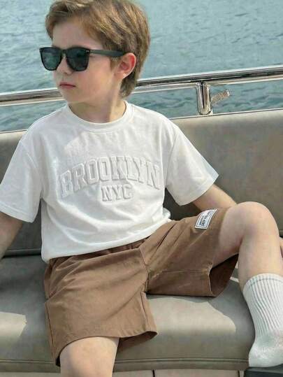 2pcs Tween Boy Casual White Letter Print Crew Neck Short Sleeve T-Shirt And Khaki Shorts Set, Suitable For Commuting, School, Daily Casual Wear, Sports, Spring/Summer,Easter Gift For Boys Suitable For Spring/Summer, Outings, Valentine's Day, Dates, Travel, Vacations, Family Gatherings, Back To School, Weddings, Evenings, Sports, Birthday Parties Boys Brown Short Set Boys Cruise Clothes Boys Khaki Shorts Boys Summer Outfit Set Boys Classy Summer Sets