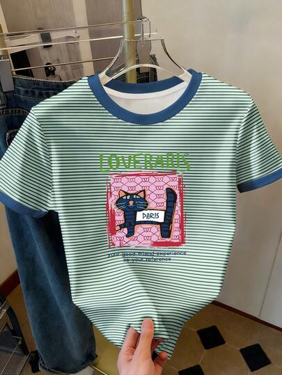 Resyla Striped Cat Graphic Contrast Ringer Tee Y2K Aesthetic "Paris Cat" Striped Print Casual T-Shirt Preppy Style Striped Cat Graphic Contrast Trim Summer Tee Cute Cat Print Striped Contrast Neck Casual Top Retro Striped "Loveraris" Cat Graphic Contrast Sleeve Tee