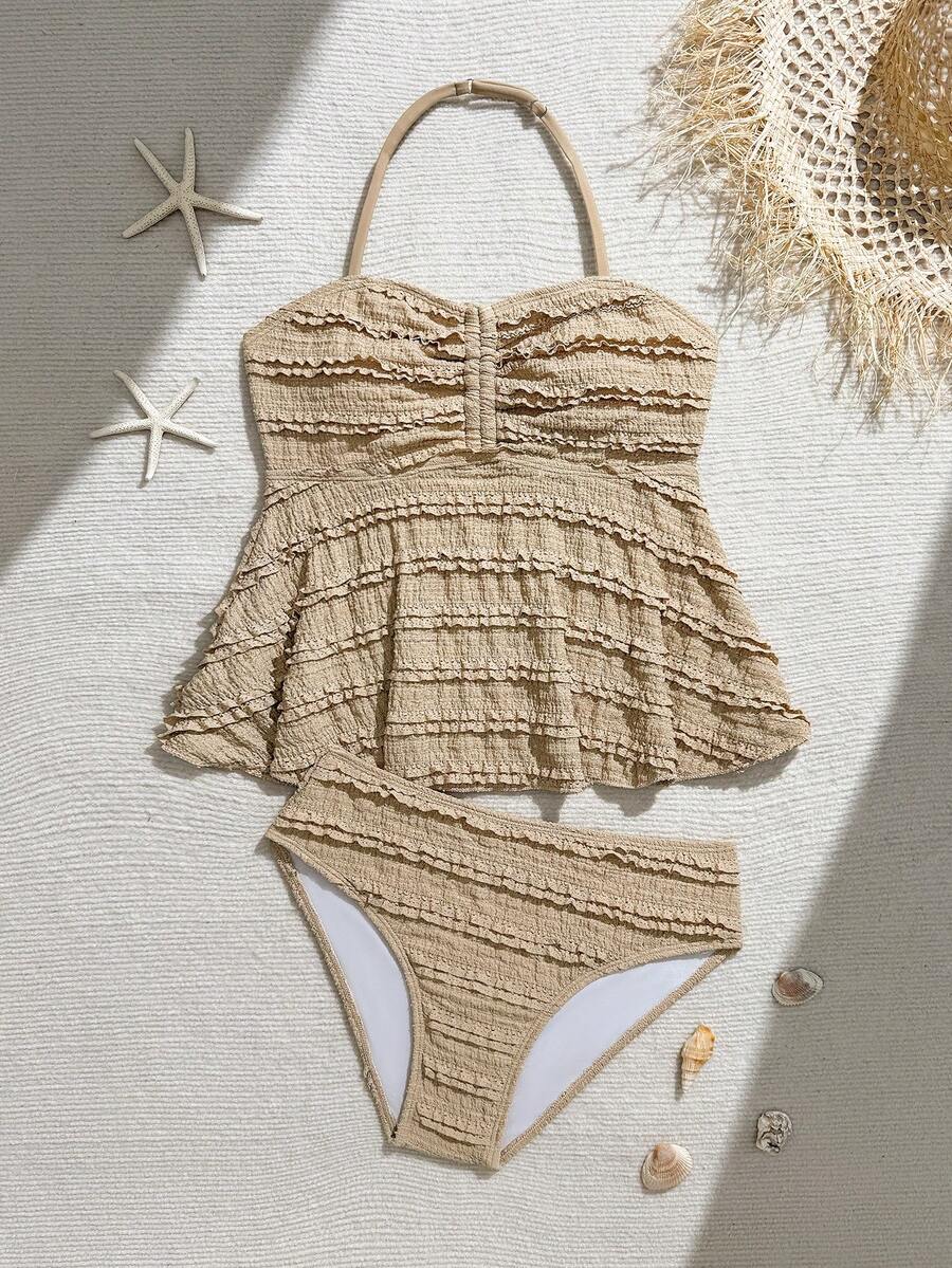 SHEIN 少女吊带泳衣,休闲保守款,浅黄色针织提花露背吊带上衣,配有抽绳和荷叶边下摆,搭配三角泳裤,时尚优雅,适合游泳、夏季度假、海滩、泳池、假日派对等场合。这款夏季泳衣套装包含荷叶边两件式泳装、复古泳装、米色泳衣、少女泳装套装、夏季少女沙滩泳装和贝壳图案泳装。 - 駝色 - 查看 1