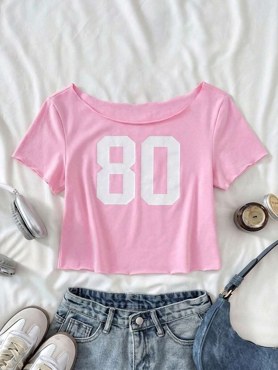 SHEIN Áo thun croptop ngắn tay cotton thoải mái, in số, kiểu dáng đường phố, vintage, dành cho bé gái tuổi teen, in hình số, vai lệch, cá tính, chất liệu cotton, màu hồng. - Màu Hồng baby - Xem 1