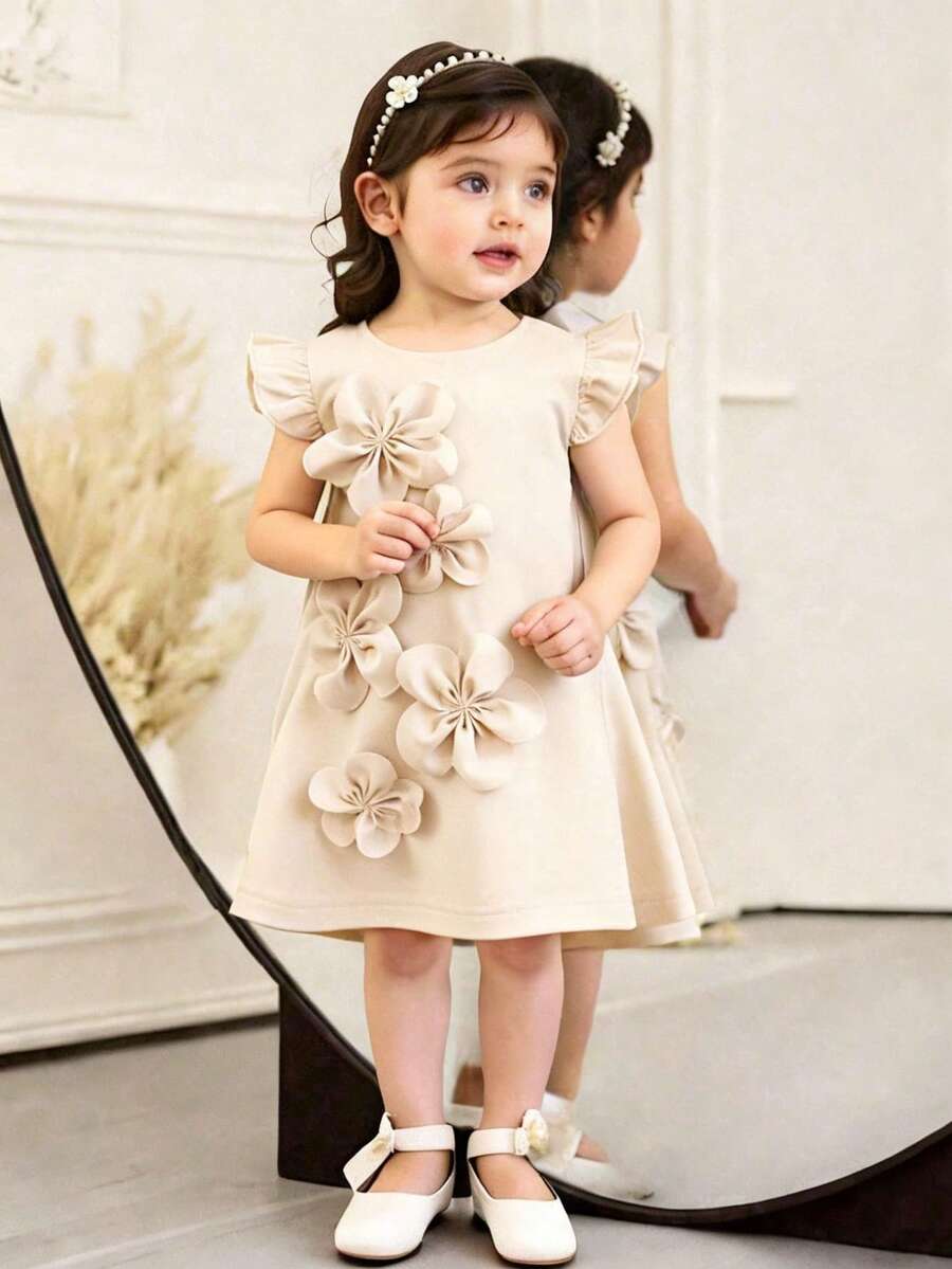 SHEIN Vestido elegante de color púrpura para niñas pequeñas para el verano, con decoración floral 3D y mangas con volantes, ligero y adecuado para uso casual, vacaciones y uso diario - Albaricoque - Ver 1