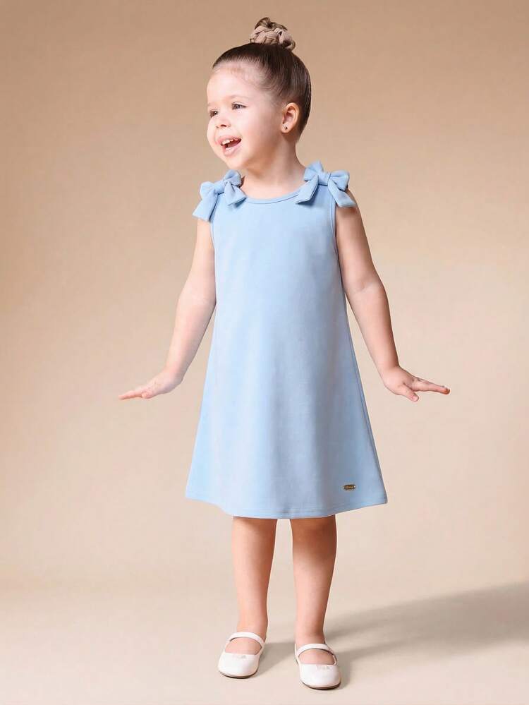 Vestido azul claro de línea A para niñas con detalles de lazo en los hombros y abertura en la espalda, longitud mini sin mangas, vestido casual de verano
