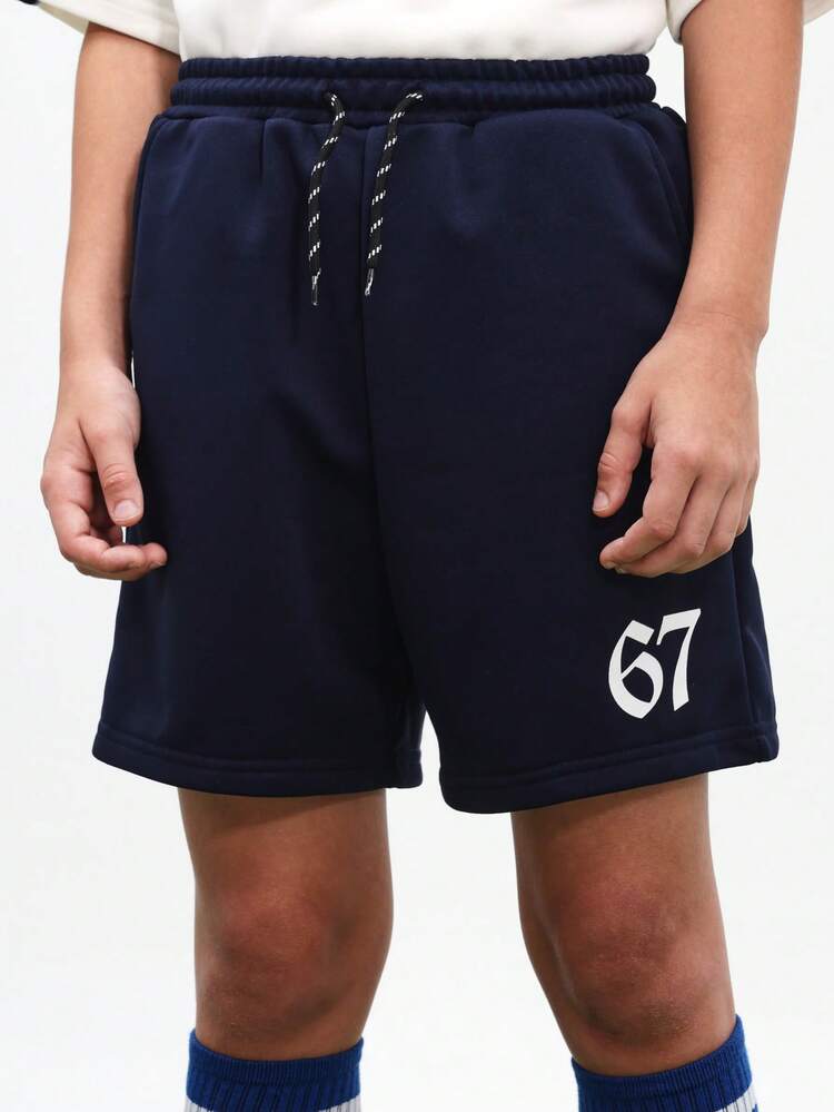 Ensemble coordonné de football surdimensionné pour garçons préadolescents, t-shirt à manches courtes blanc avec panneaux de contraste marine et short assorti marine