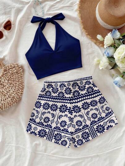 Franclia Women's Summer Vacation Two-Piece Set: Solid Color Halter Top And Floral Print Shorts. Keywords: Summer Top, Summer, Summer Outfits, Spring Outfits, Easter, Women's Easter Outfits, Women's Holiday Outfits, Party Tops, Women's Beach Outfits, Graduation/Mom Outfits, Women's Elegant Tops, Women's Elegant Suits, Women's Casual Tops, Women's Casual Suits, Women's Holiday Outfits, Summer Vacation Outfits, Women's Formal Shirts, Women's Social/Formal Tops, Women's Formal Wear, Women's Commuting Outfits, Women's Workwear, Social/Workwear Tops, Women's Country Style, Sexy Country Style, Blue Top, White Shirt Holiday Set, Casual Suit, Beach, Vacation, Holiday Outfits, Patterned Shorts.Graduation Season Attire, Fashionable Casual Commuter Wear, Business Office Wear, Versatile And Stylish Everyday Casual Wear, Urban Teacher's Professional Attire