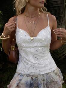 Lumalex 亮片和3D立体花卉贴花垂褶上衣，后背饰有垂坠链条细节，夏季短款上衣，适合春假、邮轮旅行、夏季假期、海滩度假、派对、情人节、女性度假、假期、派对等场合，营造浪漫情人节氛围、新少女风、波西米亚休闲风、低调奢华风、商务时尚风、海滩周末、度假氛围、优雅气质，适合派对、约会、外出、夜生活、婚礼、假日、度假、生日派对等场合。 - 白色 - 查看 8