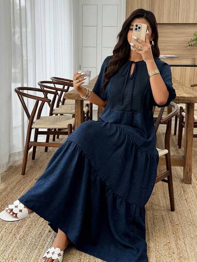 Weeklong 藏蓝色V领网纱拼接宽松棉麻长裙，适合春夏穿着，尺码齐全。适合休闲度假、日常出行和聚会等场合。