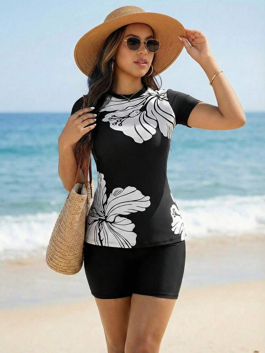 Swim Mulvari Completo da spiaggia da donna 2026 SS, costumi da bagno mediorientali, bikini a fascia, set da 2 pezzi, elegante e romantico stile BOHO con stampa floreale tropicale per vacanze al mare, top a maniche corte, zip sul retro, gonna con volant, multicolore, nero e bianco, nero, bianco, sexy e di lusso, elegante e sofisticato, romantico per le vacanze, nuova moda primavera estate 2026, Capodanno, San Valentino - Bianco e nero - Visualizzare 1