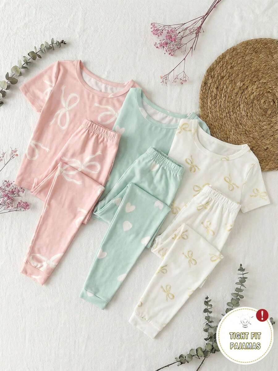 Genkimix Kids Bộ đồ ngủ ngắn tay ôm sát 6 món cho bé gái, họa tiết nơ và trái tim, co giãn, có thể giặt máy, thoải mái khi mặc, dễ bảo quản (3 bộ bán riêng lẻ) - Nhiều màu - Xem 1