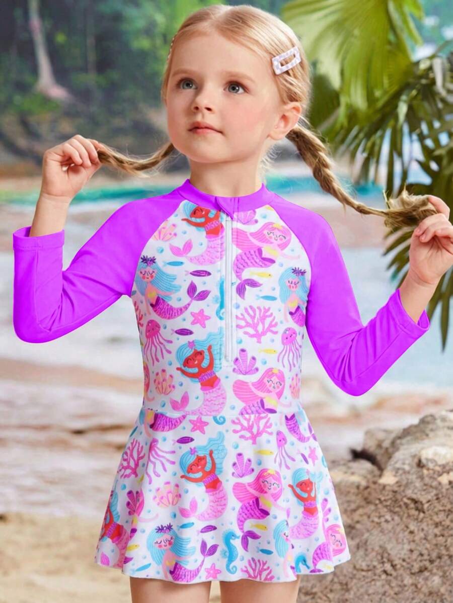 新款女童连体泳衣，单件装。这款连体泳衣采用裙摆设计，饰有可爱的卡通图案，配有拉链，甜美可爱，适合女孩和幼儿在游泳、海滩度假、水上乐园等场合穿着。长袖和裙摆设计提供良好的皮肤保护，面料优质。 - 彩色 - 查看 1