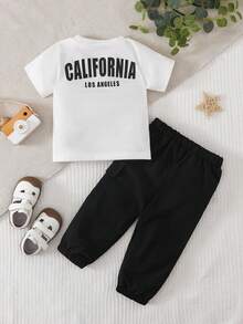 SHEIN Playful Pals Bộ áo thun ngắn tay cổ tròn thêu họa tiết cho bé trai và quần đen. - Đen và trắng - Xem 2