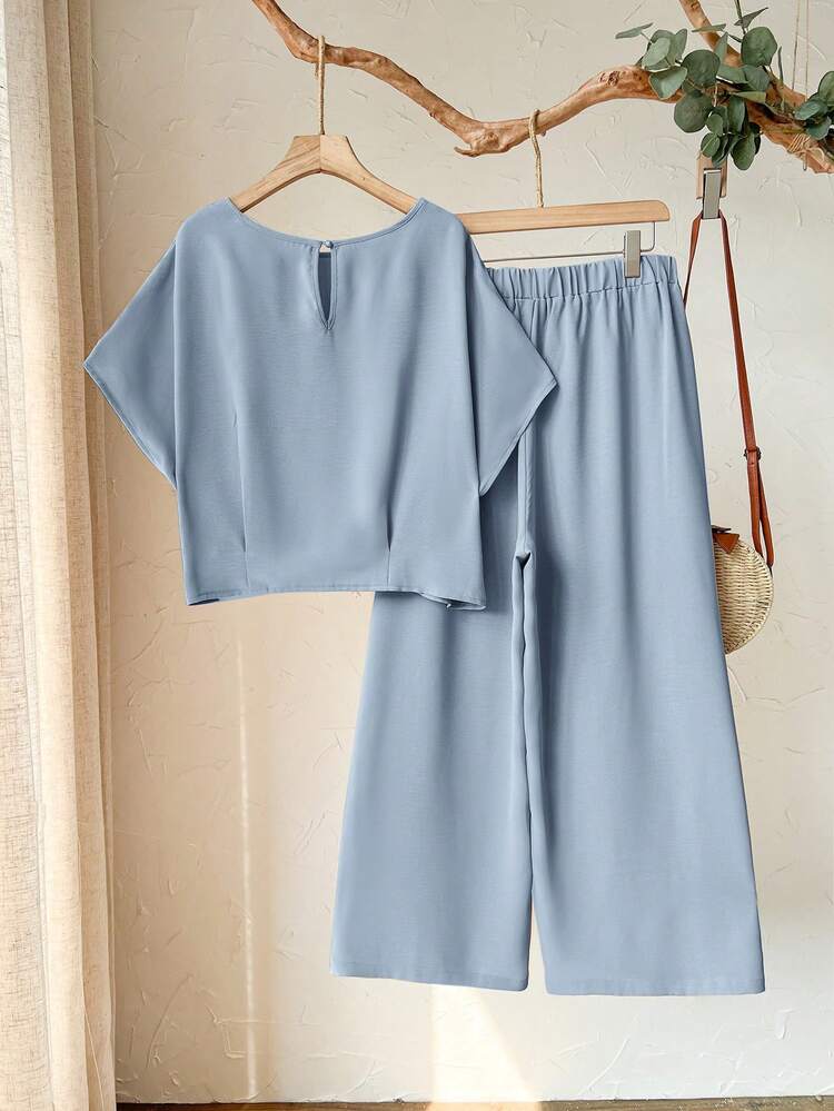 2pc Set  Plus Size Women's Spring/Summer Casual Vacation Round Neck Short Sleeve Solid Color Blue Cropped Top And Pants 2-Piece Set ,Nude Two Piece Set Two Piece Set ,Women Comfy Modest Two Piece Set ,Beige Two Piece Set, Comfortable Two Piece Set,Early Spring,Spring Break Outfits ,Vacation Outfits Women ,Holiday Outfits For Women,Spring Clothes Women,Going Out Outfits,2026 New Clothes,Simple And Fashionable For Everyday Wear, Two Piece Set Women Comfy,Daily Wear,Modest Two Piece Set, Plus Size Summer Sets,Plus Size Pants Set,Boho Set,Boho Pants Set For Women,Wide Leg Pants Set,2 Piece Casual Sets Woman, Short Sleeve Two Piece Set