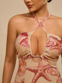 Travachic Áo tắm liền thân hở lưng, cổ yếm, họa tiết vỏ sò màu cam hồng, kiểu dáng gợi cảm, thích hợp cho kỳ nghỉ nhiệt đới, cổ chữ V sâu và có dây rút ở eo, giúp thon gọn vóc dáng, phong cách quyến rũ bãi biển, mùa hè. - Hồng - Xem 7