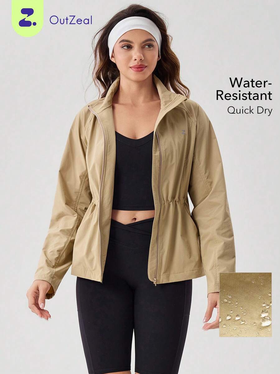 OutZeal Chaqueta para mujer para exteriores, entrenamiento y uso diario, con cuello alto, cintura con cordón y bolsillos con cremallera - Caqui - Ver 1