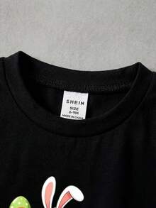 SHEIN Playful Pals 男童复活节兔子字母印花黑色圆领短袖T恤，适合婴幼儿穿着，款式多样，包括上衣、套头衫和短袖T恤。这款T恤适合复活节假期、派对、日常休闲穿着，风格甜美时尚，日常可爱，融合了兔子、卡车和复活节元素，适合春夏季节，尺码6个月至3岁，百搭基础款。 - 黑色 - 查看 5