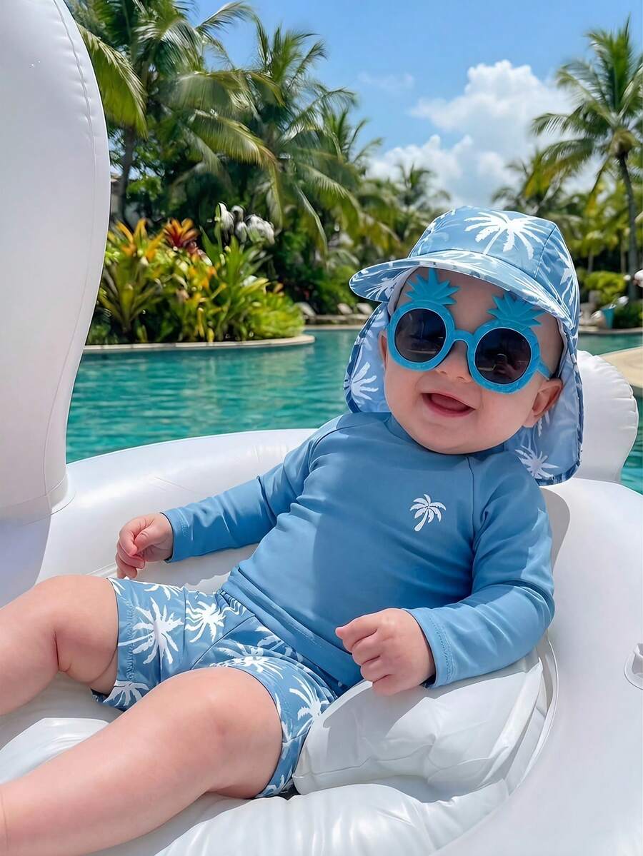 SHEIN Conjunto de 3 piezas para bebé unisex: Bañador de manga larga con protección solar y gorro con estampado de árbol de coco azul, adecuado para la playa, la piscina y las vacaciones - Neblina azul - Ver 1