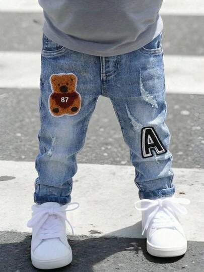 SHEIN Pantalones vaqueros elásticos ajustados con parche de oso para niños pequeños
