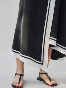 Ontre 女士黑白撞色舒适柔软高端面料哑光破洞卡纸修身腰带设计不对称下摆设计现代都市商务休闲，高品质机场休闲低调复古高端邮轮，中东简约奢华百搭必备时尚半身裙 - 黑與白 - 查看 2