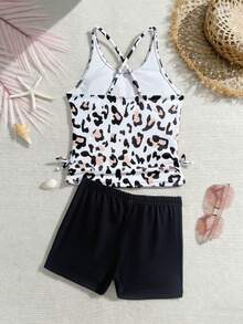 SHEIN 少女两件式泳衣，白色底色，黑色和棕色豹纹印花，细肩带上衣，抽绳腰带，纯黑色泳裤，针织面料，时尚休闲，优雅大方，适合游泳、夏季度假、海滩、泳池、派对等场合。少女夏季短裤套装，豹纹运动短裤，少女夏季服装套装，青少年女孩夏季服装套装，少女夏季短裤套装，女孩夏季服装，女士夏季上衣，女孩服装套装，夏季女孩，夏季度假服装，女孩泳装，豹纹泳装，带短裤的泳衣，女孩两件套服装，两件套服装，夏季女孩夏季套装，夏季服装，Tankini - 彩色 - 查看 4