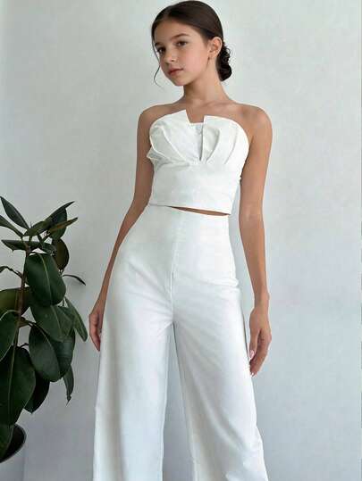 Serisse Kids Bộ đồ hai mảnh màu trắng thanh lịch dành cho bé gái tuổi teen, gồm áo croptop không dây bất đối xứng và quần ống đứng cạp cao có gọng giả.